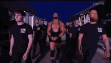 a group of men wearing aw staff shirts