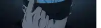 a close up of a person covering their face with their hand .