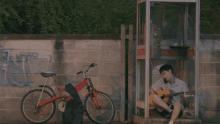 playing guitar the yearbook ultimatetroop phone booth bicycle