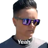 a woman wearing sunglasses has the word yeah above her neck