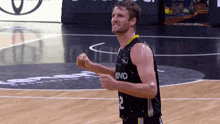 a basketball player with the number 2 on his jersey is celebrating