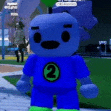 a blue teddy bear wearing a blue shirt with a number 2 on it