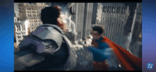 a man in a suit is fighting another man in a cape in front of a building