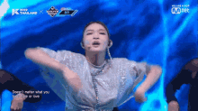 a woman is performing on a stage with the words " doesn 't matter what you baby hate or love " on the bottom
