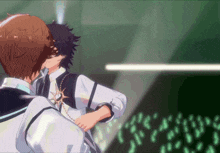 a couple of anime characters kissing each other in front of a crowd