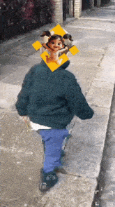 a child is walking down a sidewalk with a picture of a girl on his head