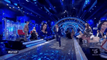 a group of people are standing on a stage with a sign that says #gfvip on the bottom