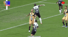 a soccer player with the number 94 on his shorts is celebrating a goal