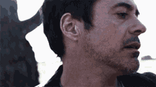 a close up of a man 's face and neck