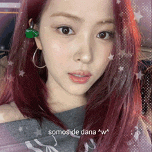 a picture of a woman with red hair and the words somos de dana w