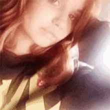 a close up of a woman taking a selfie with a man .