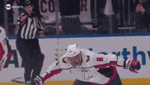 a hockey player with the number 8 on his jersey is on the ice