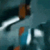 a blurry picture of a person 's face with the letter f in the lower right corner