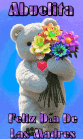 a teddy bear is holding a bouquet of flowers and says abuelita