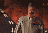 a man in a military uniform is saying i delivered the weapon the emperor requested