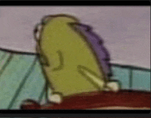 a close up of a cartoon character 's back with a purple shirt on .