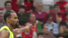 a blurry picture of a basketball player pointing