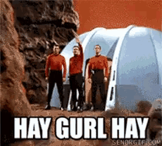 a group of men standing in front of a tent with the words hay gurl hay on the bottom