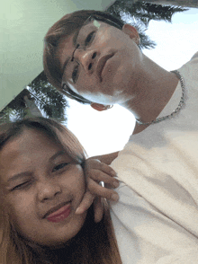 a man and a woman pose for a picture together