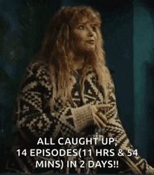a woman is wearing a sweater that says all caught up .