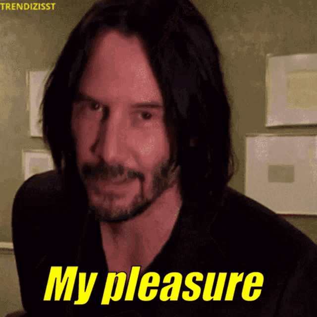 a man with long black hair and a beard says 