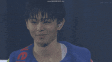 a man in a colorful jacket with the word ver on it