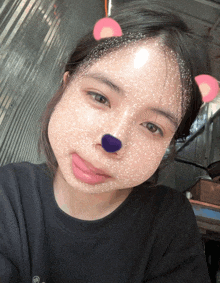 a girl with a purple nose and ears on her face