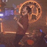 a man is dancing in front of the son of han coffee shop