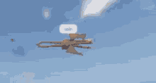 a dragon is flying through a blue sky with its wings outstretched .
