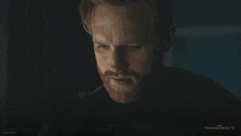 a close up of a man 's face with the words thunderbolts on the bottom right