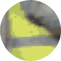 a pixelated image of a circle with a yellow triangle in the center