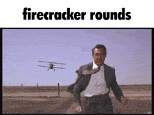 a man in a suit is running in front of a plane that says firecracker rounds on the top