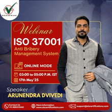 a man is standing in front of a sign that says webinar iso 37001