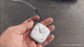 a person is holding a small remote control in their hand with youtube.com/namastecar on the bottom