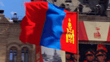 a red white and blue flag with a gold lettering that says ' tkc ' on it