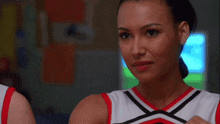 two cheerleaders covering their elbows with their hands