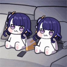 two cartoon girls are sitting next to each other on a couch .