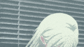a close up of a person 's head with a blind in the background