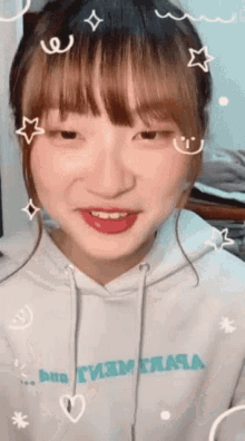 a girl wearing a white hoodie that says t3m t3a4a
