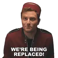 a man wearing a red hat and a red jacket says we 're being replaced