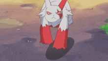 a white cat with red ears and legs is standing on the ground .
