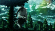 a person is hanging upside down from a tree with mountains in the background