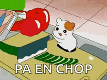 a hamster is sitting on a cutting board next to a knife and a pepper ..