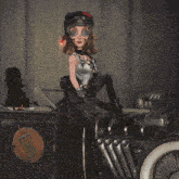 a cartoon character wearing a helmet and goggles sits on a car