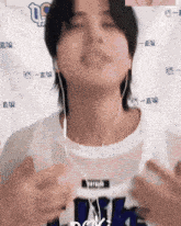 a person wearing headphones and a shirt that says ' nk ' on it