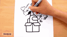 a person is drawing a box with a marker that says sharpie on it