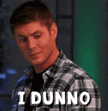 a man in a plaid shirt has the words i dunno on his face