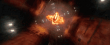 a large fireball is exploding in the middle of a dark space .