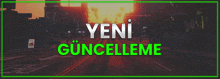 a picture of a city with the words yeni güncelleme written in green