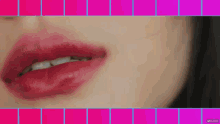 a close up of a woman 's mouth with red lipstick .